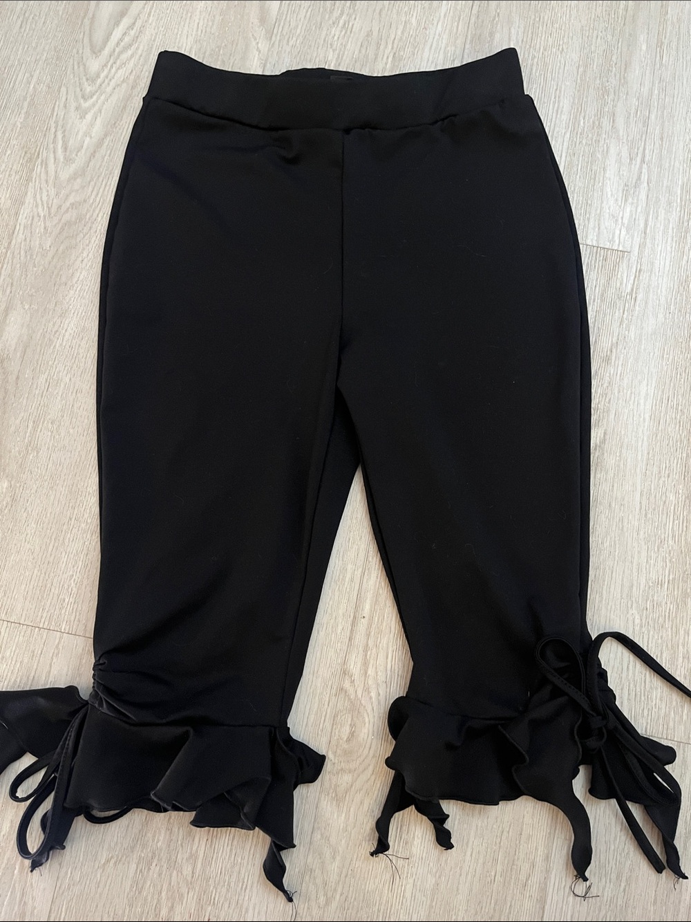 Black Ruffle Hem Capris with Tie Details medium